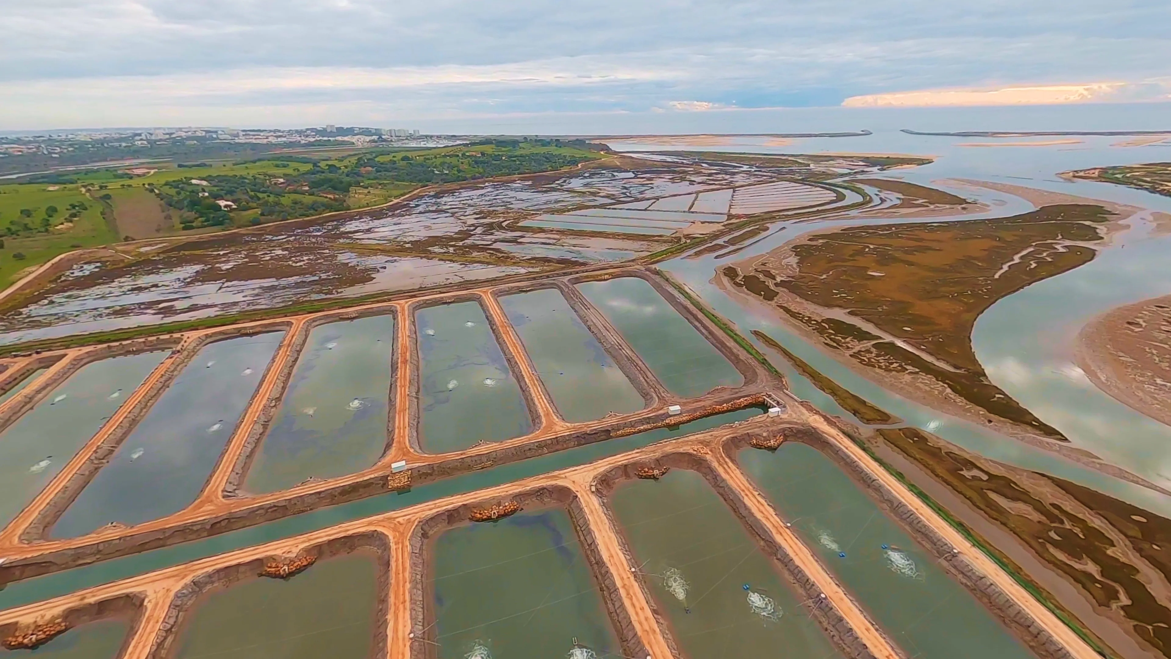 Aerial view of NaturaFish Ria do Arade estuary farm and ponds near Portimão