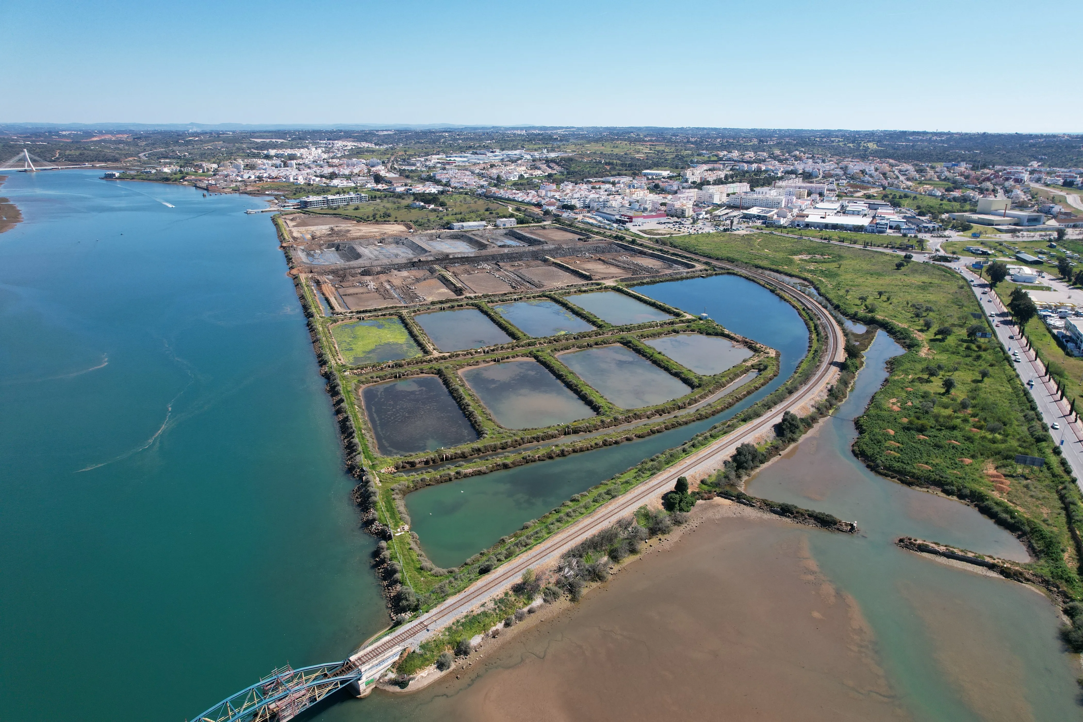 Aerial view of NaturaFish estuary ponds along the Ria do Arade near Portimão in the Algarve